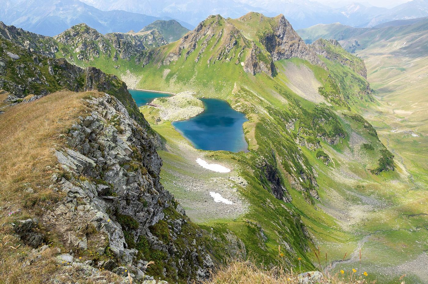 glacial lake beneath steep mountain peaks